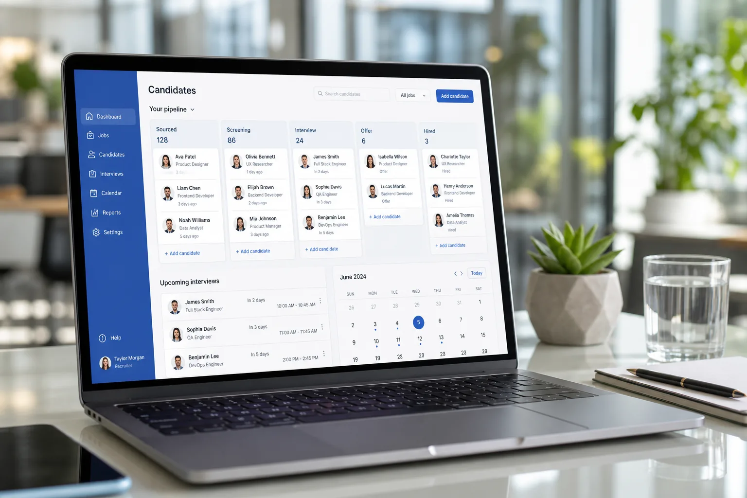 Laptop showing a job portal platform dashboard with candidates, job listings, and hiring analytics